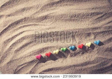 Close Up Color Of Mini Heart On Sand Of Beach From Top View, With Vintage Tone Effect,