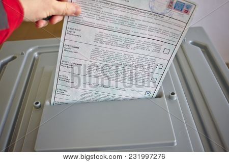 MOSCOW, RUSSIA - MARCH 18 2018: Russian citizen votes for President Vladimir Putin on the Russian presidential election 2018