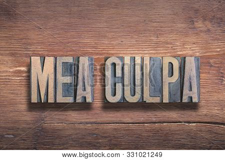 Mea Culpa Ancient Latin Saying Meaning «through My Fault» Combined On Vintage Varnished Wooden Surfa