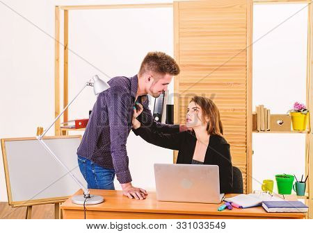 A Thirst For Romance. Couple Of Young Coworkers Conducting Office Romance. Workplace Romance Of Hand