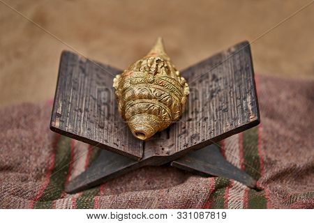 Shankha - Brass Conch Shell, Religious Importance In Hinduism And Buddhism On The Wooden Folding Boo