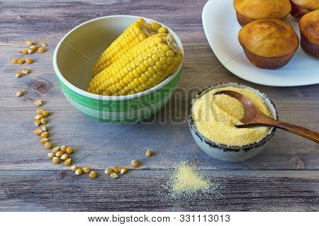 Boiled Corn Cobs, Cornmeal And Cornbread Prepared As A Muffin ( Proja ). Rustic Background