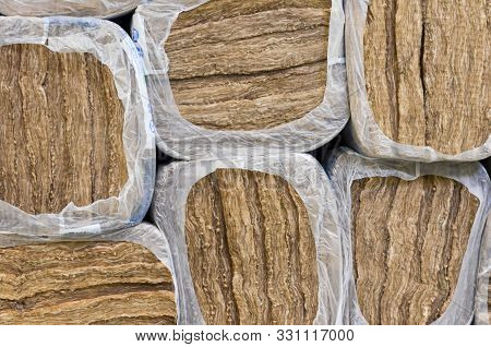 Pile Of   Round Basalt Mineral Wool Packages  In Plastic Foil .