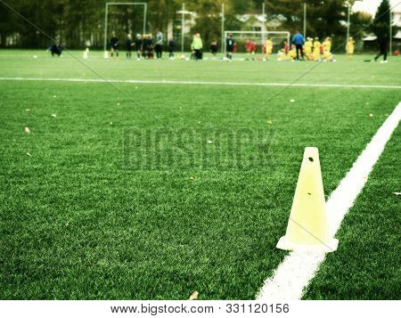 Football Players Athletic Training In Summer. Soccer Field Grass On The Green
