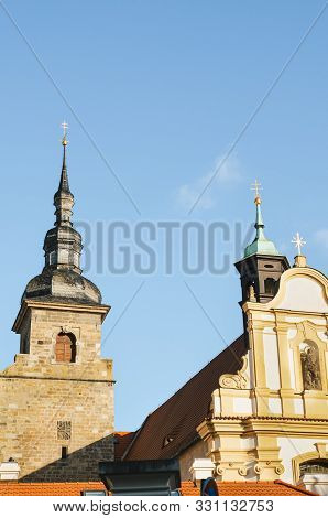 Franciscan Monastery In Plzen, Czech Republic With Light Blue Sky In Background. The Church And Mona