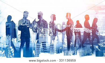 Teamwork And Partnership. Business People In City