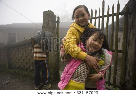 Sapa, Lao Cai, Vietnam - March 12, 2011: Very Funny And Happy Kids Playing Hide And Seek In A Misty 