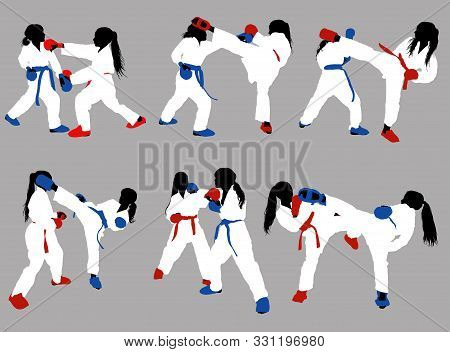 Karate Girls In White Kimonos And Red And Blue Belts And Protective Ammunition Sparring Against A Gr