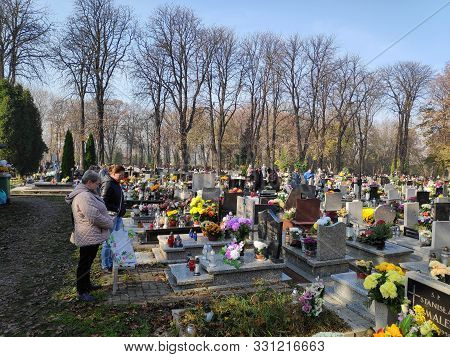 Bytom, Poland - November 1, 2019: People Visit Cemetery During All Saints Day In Bytom. All Saints D