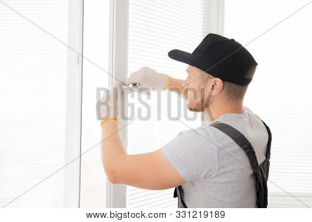 Construction Worker Man Install Plastic White Upvc Windows In House