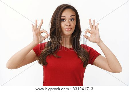 Waist-up Shot Satisfied Brunette Female Customer In Red T-shirt Show Okay, Ok Signs Give Her Approva