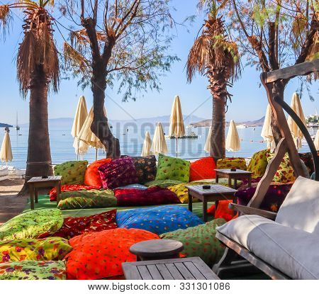 A Bright Colorful Beach On The Shores Of The Calm Blue Bay Of The Aegean Sea In The Early Morning. B