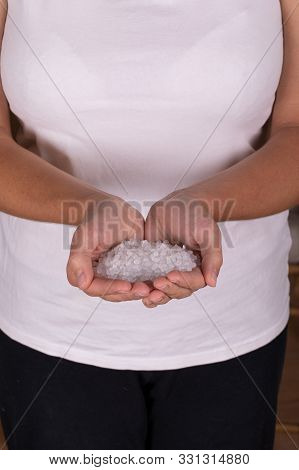 Small Plastic Pellets On The Finger.micro Plastic. Air Pollution.