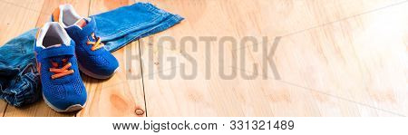 Accessories,  Jeans And Sneakers On Wooden Background