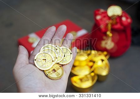 New Year Gift, Red Pouch Money Bag, Chinese Gold Coins And Gold Ingots With Chinese Character Meanin