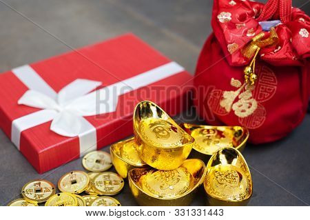 New Year Gift, Red Pouch Money Bag, Chinese Gold Coins And Gold Ingots With Chinese Character Meanin