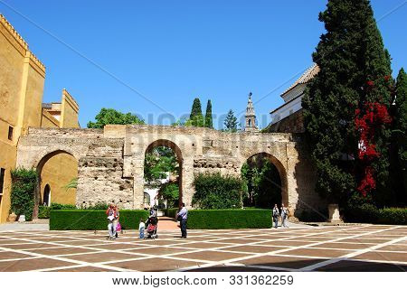 Seville, Spain - April 12, 2008 - Patio De La Monteria In The Castle Of The Kings With The Giralda T