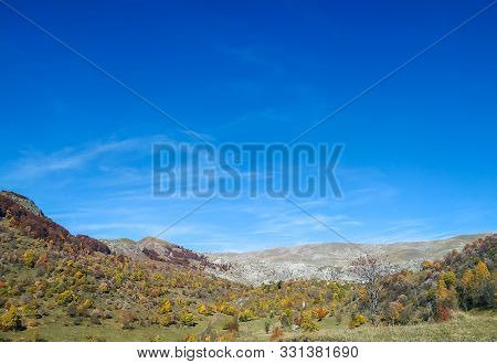 Beautiful Horizon Of The Environment With Green Meadow On The Hills And Blue Sky Autumnal Day While 