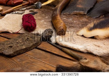 Work Table Of A Tanner With Material For Needlework Tanned Leather Deer And Yarn