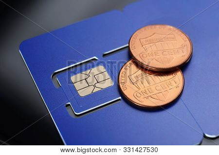 Violet Sim Card Pre-cuted Mini, Micro, Nano Sizes And Two One Cent Coins.  Cheap Communications Conc