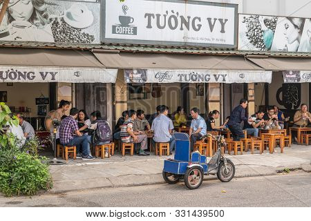 Da Nang, Vietnam - March 10, 2019: Historic Downtown Urban Neighborhood Scene. People On Small Woode