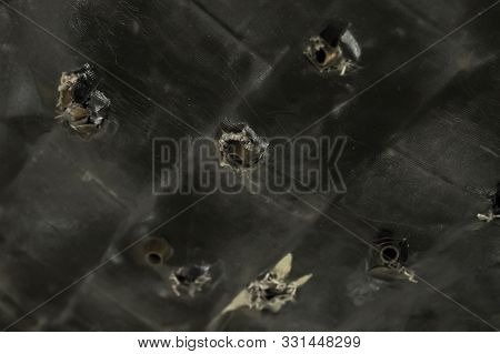 Army Background Shot Dark Bulletproof Vest With Bullet Cases From A Heavy Machine Gun