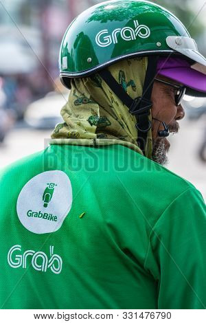 Da Nang, Vietnam - March 10, 2019: Back Of Man With Beard, Glasses And Helmet, A Free Contractor Of 