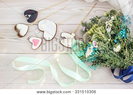 The Concept Of St. Valentine's Day And Wedding With A Beautiful Bouquet Of Wild Flowers, White Woode