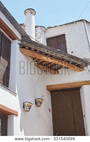 Traditional Roof With Tiles And Chimney In Capileira, Andalusia, Spain