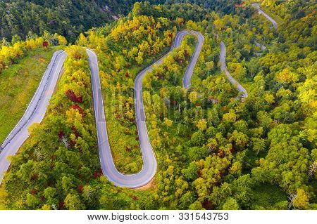 Aerial View Of Winding Road On Mountain In Autumn