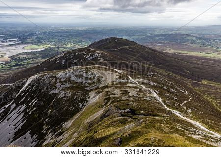 Hiking With Trail, Rocks And Vegetation At Croagh Patrick Mountain
