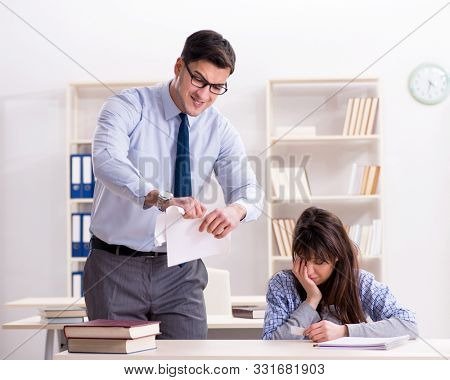 Male lecturer giving lecture to female student
