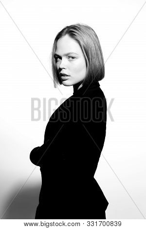 Stylish Black And White Portrait Of A Beautiful Model. Isolated On White Background. Epic Light And 