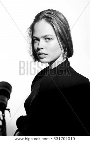 Stylish Black And White Portrait Of A Beautiful Model. Isolated On White Background. Epic Light And 