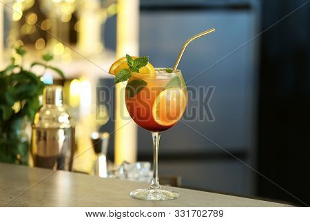Fresh Alcoholic Cocktail With Orange And Mint On Bar Counter