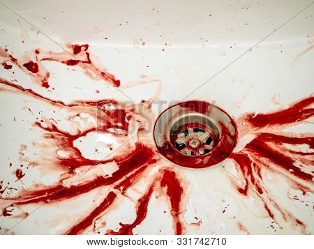 Blood Stains In Bathroom In White Ceramic Sink, Bleeding, Criminal And Suicide Concept. Splashes Of 