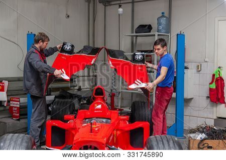 Novosibirsk, Russia - 11.01.2019: The Process Of Repairing And Restoring A Red Ferrari Formula 1 Car