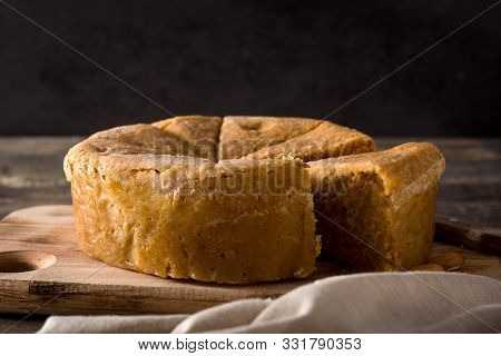 Traditional Christmas Marzipan Slice On Wooden Table.