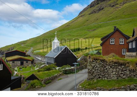 Bour Village. Typical Grass-roof Houses And Green Mountains. Vagar Island, Faroe Islands. Denmark. E
