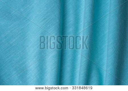 Close-up Fragment Of A Beautiful Mint Cotton Fabric. Concept Of High-quality Raw Materials For Tailo