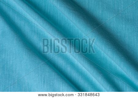 Close-up Fragment Of A Beautiful Mint Cotton Fabric. Concept Of High-quality Raw Materials For Tailo