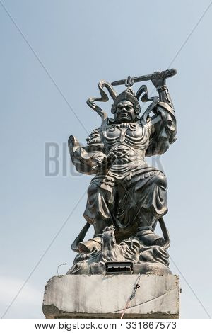Da Nang, Vietnam - March 10, 2019: Chua An Long Chinese Buddhist Temple. Closeup Of Bronze Statue Of