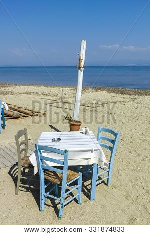 Nea Fokea, Kassandra,  Greece - March 31, 2019: Typical Greek Restaurant At The Beach Of Nea Fokea, 