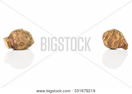 Group Of Two Whole Fresh Brown Jerusalem Artichoke Isolated On White Background