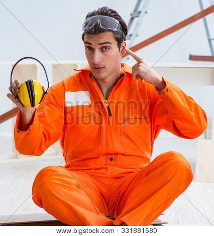 Worker showing the importnace of wearing noise cancelling headph