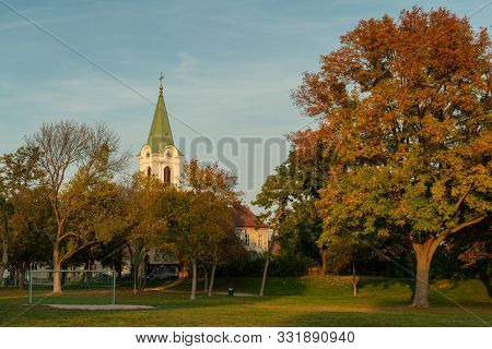 Jedlesee Aupark And Church On A Colorful Autumn Evening (vienna, Austria)
