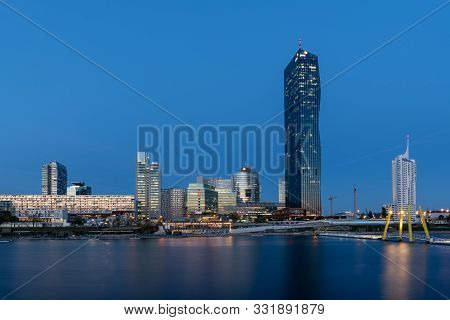 Skyline Of The High Buildings Near The Danube In Vienna, Austria On A Clear Evening After Sunset