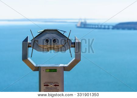 Kerch, Crimea, Russia - October 9, 2019: Tourist Binoculars To View Crimean Bridge Across Kerch Stra