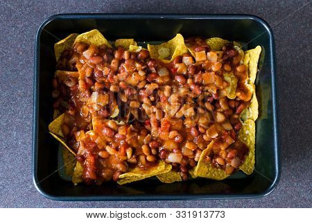 Following A Plant-based Diet Concept, Vegan Nachos Recipes With Corn Chips And Chilli Beans In The M