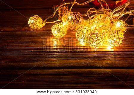 Christmas Lights Decoration On Brown Wooden Background